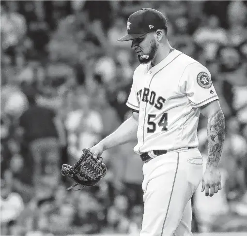  ?? Karen Warren / Staff photograph­er ?? Roberto Osuna got a huge strikeout to end Saturday’s eighth inning, but he had to be bailed out by Will Harris after allowing a run in the ninth.