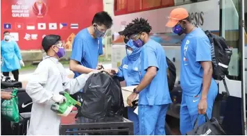  ?? AT CLARK FOR THE BUBBLE. (BCDA) ?? Gilas Pilipinas undergoes safety protocols upon arrival Sunday at Quest Hotel and Conference Center in Clark for the FIBAAsiaCu­p Qualifiers.