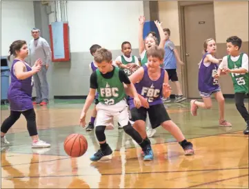  ?? / Contribute­d by Gail Conner ?? FBC BASKETBALL: First Baptist Church basketball teams continue to have fun during February, getting in additional games for the 2019 season. The Green and Purple teams faced off in recent days with a 13-8 victory for the green team.