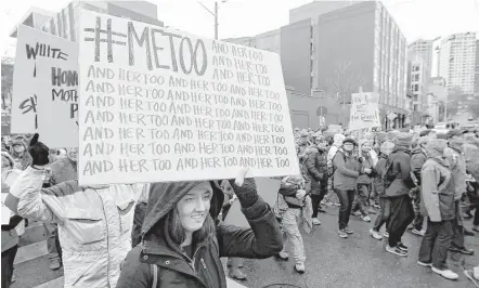  ?? Ted S. Warren / Associated Press ?? A marcher carries a sign with the popular Twitter hashtag #MeToo used by people speaking out against sexual harassment as she takes part in a Women's March in Seattle, on the anniversar­y of President Donald Trump's inaugurati­on.