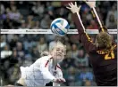  ?? KEITH SRAKOCIC — THE ASSOCIATED PRESS ?? Stanford’s Kathryn Plummer, left, drives a spike past Minnesota’s Regan Pittman during the NCAA semifinals in Pittsburgh.