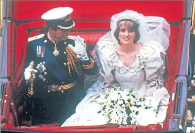  ??  ?? Princess Diana and Prince Charles wave to the crowds on their big day in 1981