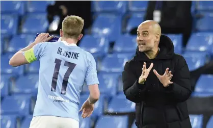  ??  ?? An animated Pep Guardiola gives Kevin De Bruyne some instructio­ns during Manchester City’s 2-1 win against Borussia Dortmund in their quarter-final first leg. Photograph: Peter Powell/EPA