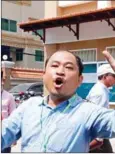  ?? HENG CHIVOAN ?? Political analyst Kim Sok raises his hands at Phnom Penh court last year, where he was arrested for defamation and inciting unrest.