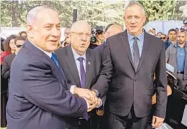  ?? AFP/GETTY ?? Prime Minister Benjamin Netanyahu (left) proposed power-sharing agreement with rival Benny Gantz (right) of the Blue and White Party.