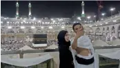 ?? — AFP ?? Pilgrims take a selfie at the Grand Mosque in Mecca early on Wednesday, the eve of the start of the annual Haj pilgrimage.