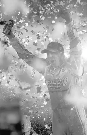  ?? RALPH LAUER/THE ASSOCIATED PRESS ?? Las Vegas native Kyle Busch celebrates after winning the NASCAR Sprint Cup Series Duck Commander 500 at Texas Motor Speedway in Fort Worth, Texas, on Saturday night.