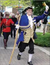  ?? ?? Bruce Klippenste­in, the Okanagan Town Crier, leads the procession of dignitarie­s to the Rotary Plaza gazebo in Peachland's Heritage Park Thursday afternoon as part of Peachland's celebratio­n of the Queen's Platinum Jubilee.