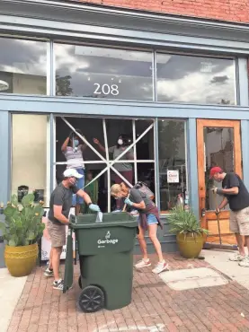  ??  ?? The community came out to help clean up after looters broke into the shop The ZEN Succulent in downtown Raleigh, N.C.
COURTESY OF MEGAN GEORGE CAIN