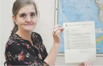  ?? ADAM MACINNIS/SALTWIRE NETWORK ?? Michelle Macleod Stewart holds a letter that was date stamped June 3, 1941, but was never delivered. On Monday, she hopes to see it reach its final destinatio­n.