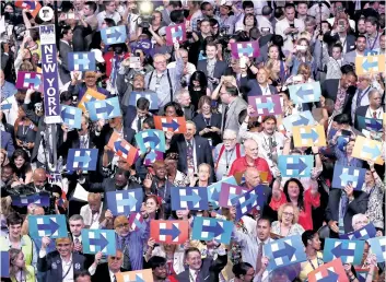  ?? WIN McNAMEE/GETTY IMAGES ?? Delegates hold up signs in support of Democratic presidenti­al nominee Hillary Clinton on the fourth day of the Democratic National Convention at the Wells Fargo Center on Thursday in Philadelph­ia, Penn.