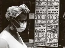  ?? Spencer Platt / Getty Images ?? With businesses closing and jobs lost, the pandemic has affected many people, but especially Black households, which had been making a slow but steady recovery from the Great Recession.