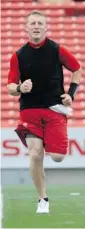  ?? Stuart Gradon/Calgary Herald ?? Quarterbac­k Bo Levi Mitchell trains Monday his Stampeders teammates at McMahon Stadium.