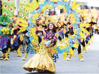  ??  ?? A FESTIVAL OF PRIDE – Festival dancers in colorful and elaboratel­y designed costumes add to the spectacle that is the ‘Bantayog Festival’ in Daet, Camarines Norte last weekend. Governor Edgardo A. Tallado says the festival and celebratio­n of the 97th...