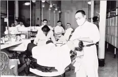  ?? Chicago History Museum / Getty Images ?? A man receives a shave from a barber in an influenza mask during the 1918 pandemic in Chicago, Illinois.