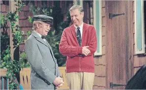  ?? LYNN JOHNSON THE ASSOCIATED PRESS ?? David Newell, as Mr. McFeely, left, and Fred Rogers on the set of "Mister Rogers' Neighborho­od," from the film, "Won't You Be My Neighbor?"