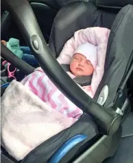  ??  ?? Take regular breaks: Baby Harper in her seat