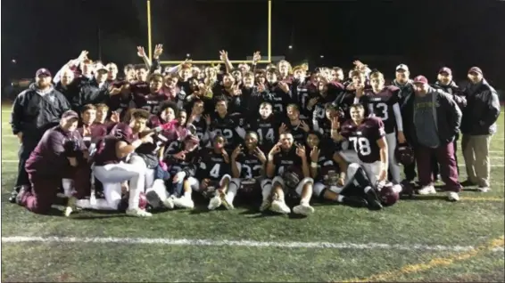  ?? THOMAS NASH - DIGITAL FIRST MEDIA ?? Members of the Pottsgrove football team pose with the trophy after winning the District 1-4A championsh­ip on Friday night.