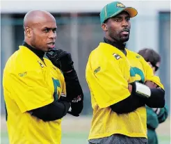  ?? ED KAISER, EDMONTON JOURNAL ?? Edmonton Eskimos quarterbac­ks Kerry Joseph, left, and Steven Jyles watch rookie training camp on Wednesday.