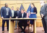  ?? Julia Bergman / Hearst Connecticu­t Media file photo ?? Gov. Ned Lamont signs a bill on June 22 making recreation­al marijuana legal for adults in Connecticu­t begining July 1.