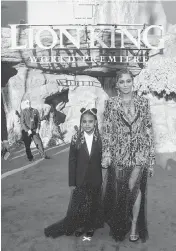  ?? ALBERTO E. RODRIGUEZ Getty Images for Disney/TNS, file ?? Blue Ivy Carter, left, and Beyoncé attend the World Premiere of Disney’s “The Lion King” at the Dolby Theatre on July 9, 2019, in Hollywood, Calif.