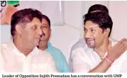  ?? PIC BY PRADEEP PATHIRANA ?? Leader of Opposition Sajith Premadasa has a conversati­on with UNP MP and Biyagama Organizer Ruwan Wijewarden­e at a gathering organised by the latter in Biyagama over the weekend where Mr. Premadasa said he would not divide the UNP though he is slated to lead a new alliance to contest the general elections.