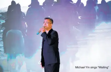  ?? ?? Michael Yin sings “Waiting”