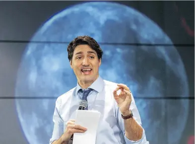  ??  ?? Prime Minister Justin Trudeau speaks to students at the Canadian Space Agency headquarte­rs, Thursday in St. Hubert, Que., announcing Canada has joined a NASA-LED mission to set up an outpost for lunar exploratio­n.