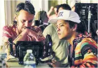  ??  ?? Cameron Duddy (far left), a director and country musician, has collaborat­ed with Bruno Mars on five hit music videos, including this year’s VMA nominee, “24K Magic,” shown above.