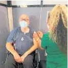  ?? Photo / Supplied ?? Michael Wood from Levin receiving his flu vaccinatio­n from nurse Desiree Paul, at Berrys Health Centre Pharmacy.