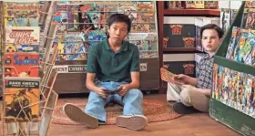  ?? CBS ?? Tam (Ryan Phuong) and Sheldon (Iain Armitage) hang out in a comic-book story in a season from “Young Sheldon” last season. A grown-up Tam will turn up on this season’s “The Big Bang Theory.”