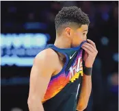  ?? MATT YORK/ASSOCIATED PRESS ?? Even with a young star like Devin Booker, pictured here after Phoenix’s Game 7 loss to Dallas, it’s possible the sun has set on the Suns as a title contender.