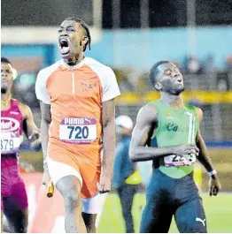  ?? GLADSTONE TAYLOR/MULTIMEDIA PHOTO EDITOR ?? The final-leg runner from Flying Angels (720), a Canada-based track club, crosses the line to win the Boys’ Class One 4x200 metres final at last Saturday’s Gibson McCook Relays at the National Stadium..