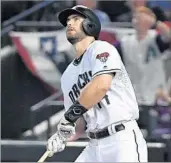  ?? NORM HALL/GETTY ?? Paul Goldschmid­t watches his three-run homer in the Diamondbac­ks’ wild-card victory over the Rockies.