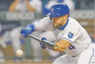  ?? REED HOFFMANN/ASSOCIATED PRESS ?? The Royals’ Alex Gordon bunts Sept. 12 against the Pirates in Kansas City, Mo. He announced he is retiring.