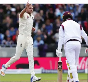  ??  ?? ON POINT: Broad celebrates the wicket of Kemar Roach in the tourists’ collapse