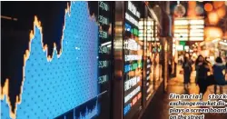  ??  ?? Financial stock exchange market displays a screen board on the street