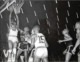  ?? AP FILE ?? Loyola’s Vic Rouse’s putback against Cincinnati in 1963 was the first buzzer-beating winner in an NCAA final. Rouse was one of four African-American starters for the Ramblers.