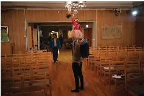  ?? The Associated Press ?? ■ Neelu Singh holds her daughter Svalbie after a Jan. 8 service at Svalbard Kirke in Longyearby­en, Norway. She and Svalbie started coming to church for the weekly “baby song hour.”