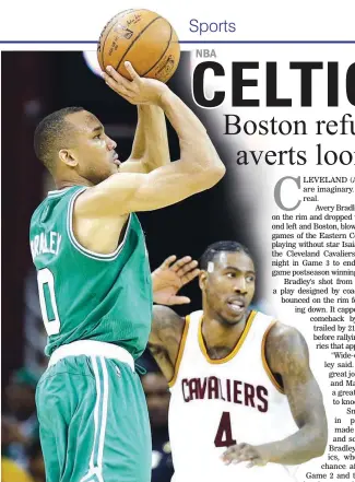  ??  ?? Boston Celtics' Avery Bradley, left, shoots over Cleveland Cavaliers' Iman Shumpert during the second half of Game 3 of the NBA Eastern Conference finals Sunday in Cleveland. The Celtics won, 111-108, as Bradley hit a two-bounce 3-pointer just before...