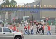  ?? ALLEN J. SCHABEN / LOS ANGELES TIMES ?? Writers Guild of America strikers picket outside Universal Studios in 2007.