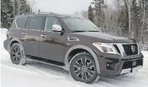  ?? NEIL VORANO/DRIVING ?? The 2017 Nissan Armada Platinum has powerful towing capacity, but the cargo space could use improvemen­t.