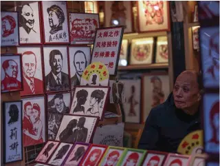  ?? Photo by AFP ?? This January 10, 2024 photo shows papercut images of Russian President Vladimir Putin, Chinese President Xi Jinping, former Chinese leaders, and others on display and for sale at a store in Shanghai.