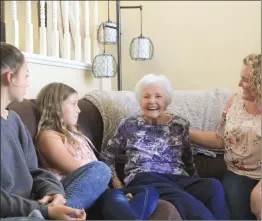  ?? Michele Lutes/The Signal (See additional photos at signalscv.com) ?? Carletta Stark, who lives in Saugus, smiles as she sits with her granddaugh­ter Julie McMillen, right, and great-granddaugh­ters Jennah and Lauren.