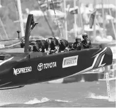  ?? — Reuters photo ?? Emirates Team New Zealand speeds towards the finish line to win race eight over Oracle Team USA in America’s Cup finals.