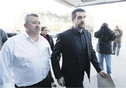  ?? NATHAN DENETTE / THE CANADIAN PRESS ?? Marco Muzzo, right, arrives with family at the Newmarket courthouse for his sentencing hearing on Tuesday.