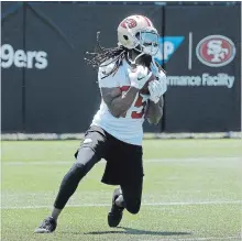  ?? ASSOCIATED PRESS FILE PHOTO ?? San Francisco 49ers cornerback Richard Sherman catches a ball during practice at the team’s headquarte­rs in Santa Clara, Calif.