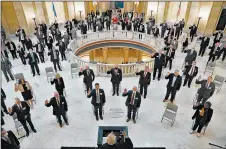  ?? SUE OGROCKI/AP ?? Data show almost 200 state legislator­s nationwide have tested positive for the virus. Above, House members in a ceremonial swearing-in this month in Oklahoma City.