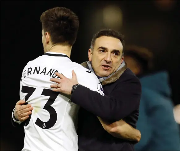  ?? Reuters ?? Carlos Carvalhal, right, celebrates with Federico Fernandez as Swansea City rallied to defeat Watford in the Portuguese’s first match as the Welsh club’s manager
