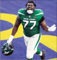  ?? Ashley Landis / Associated Press ?? Jets offensive tackle Mekhi Becton celebrates after a win over the Rams on Dec. 20.